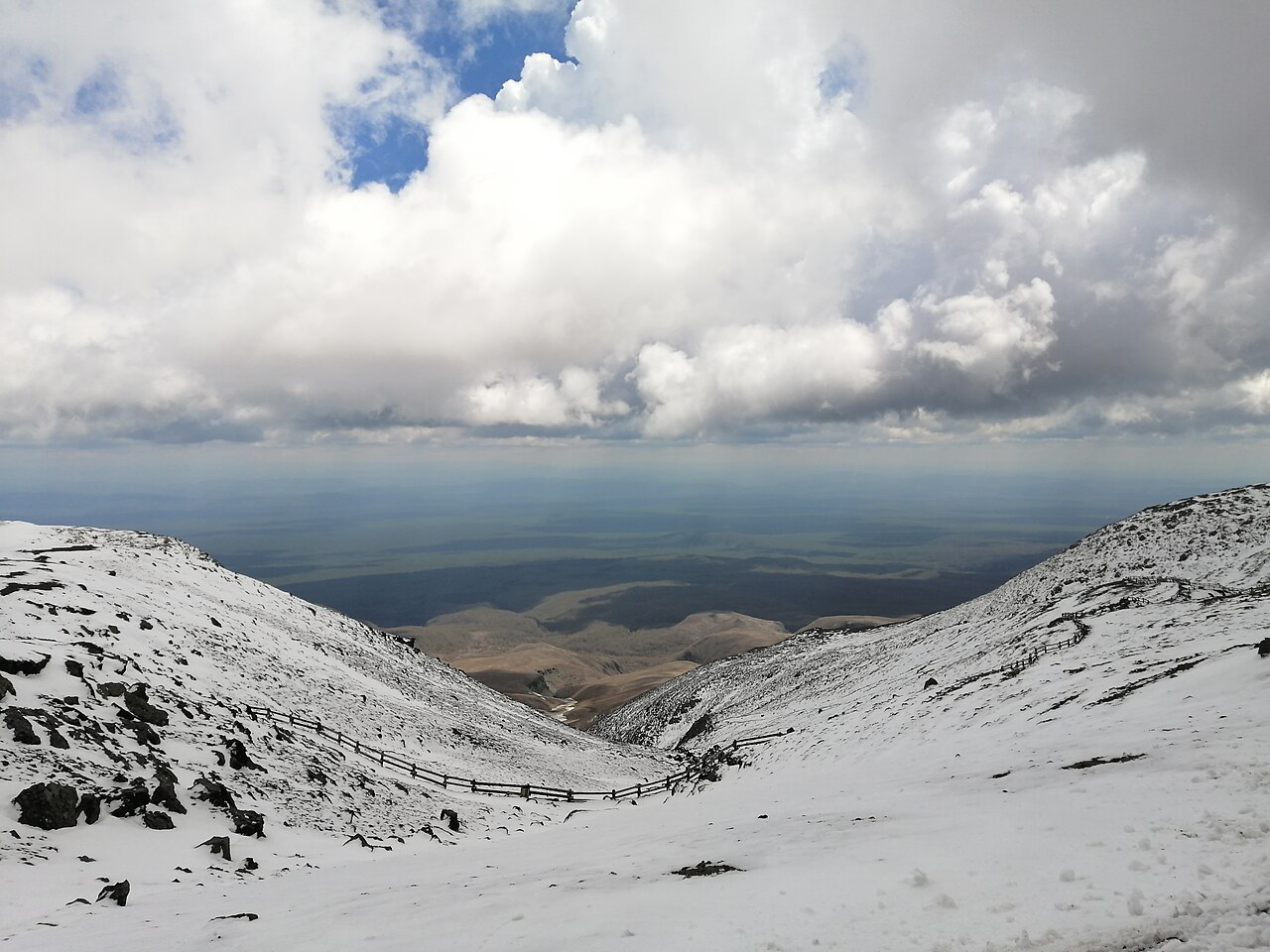 Snow-covered slopes of Changbaishan under low clouds
